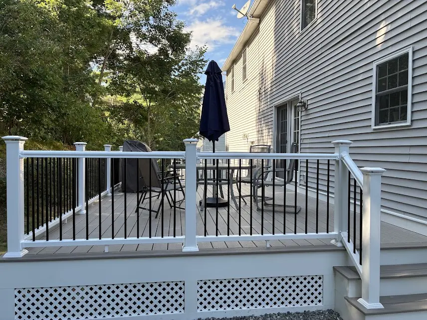gray-deck-white-railing-backyard-view
